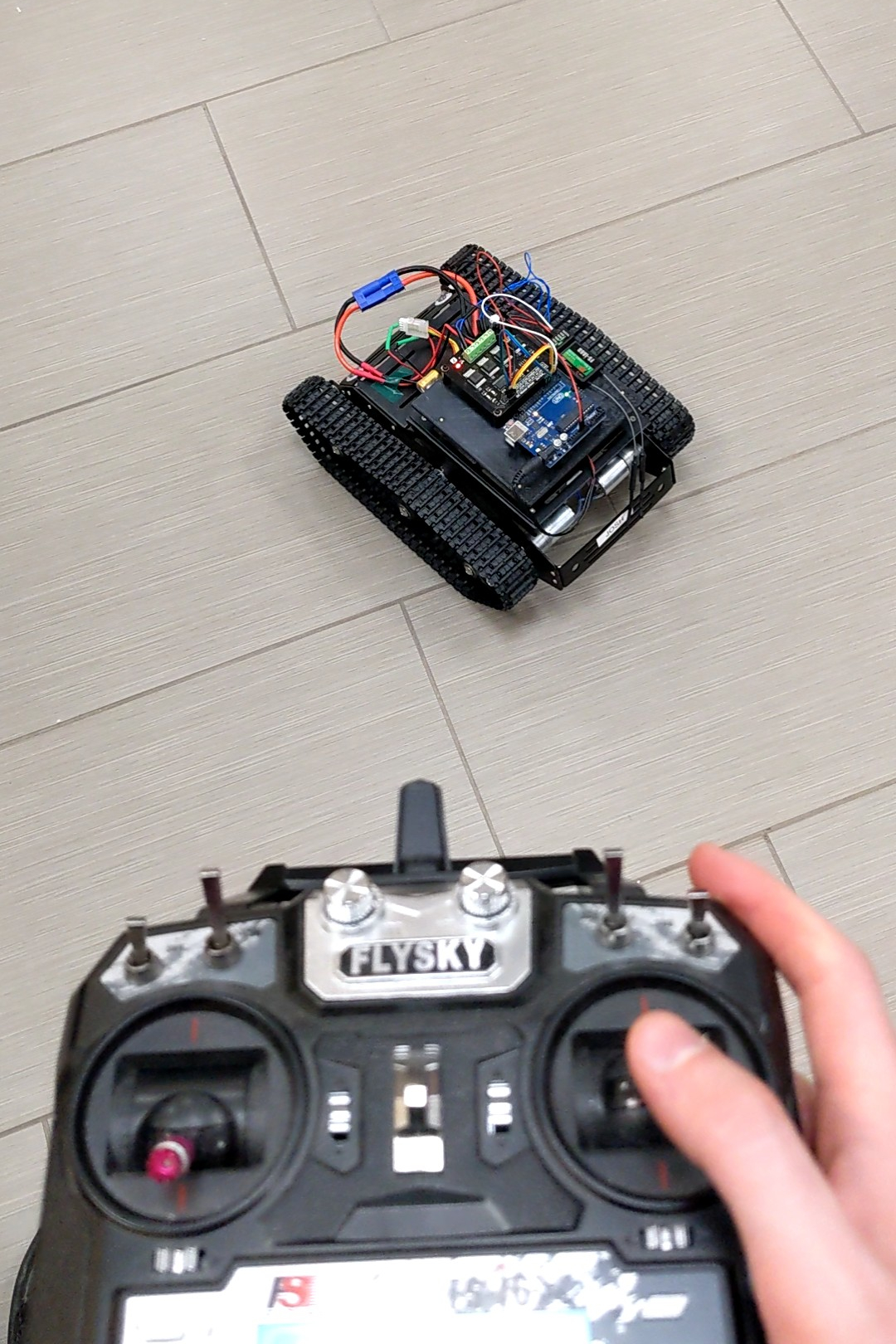 Driving the tank robot around using a radio controller.